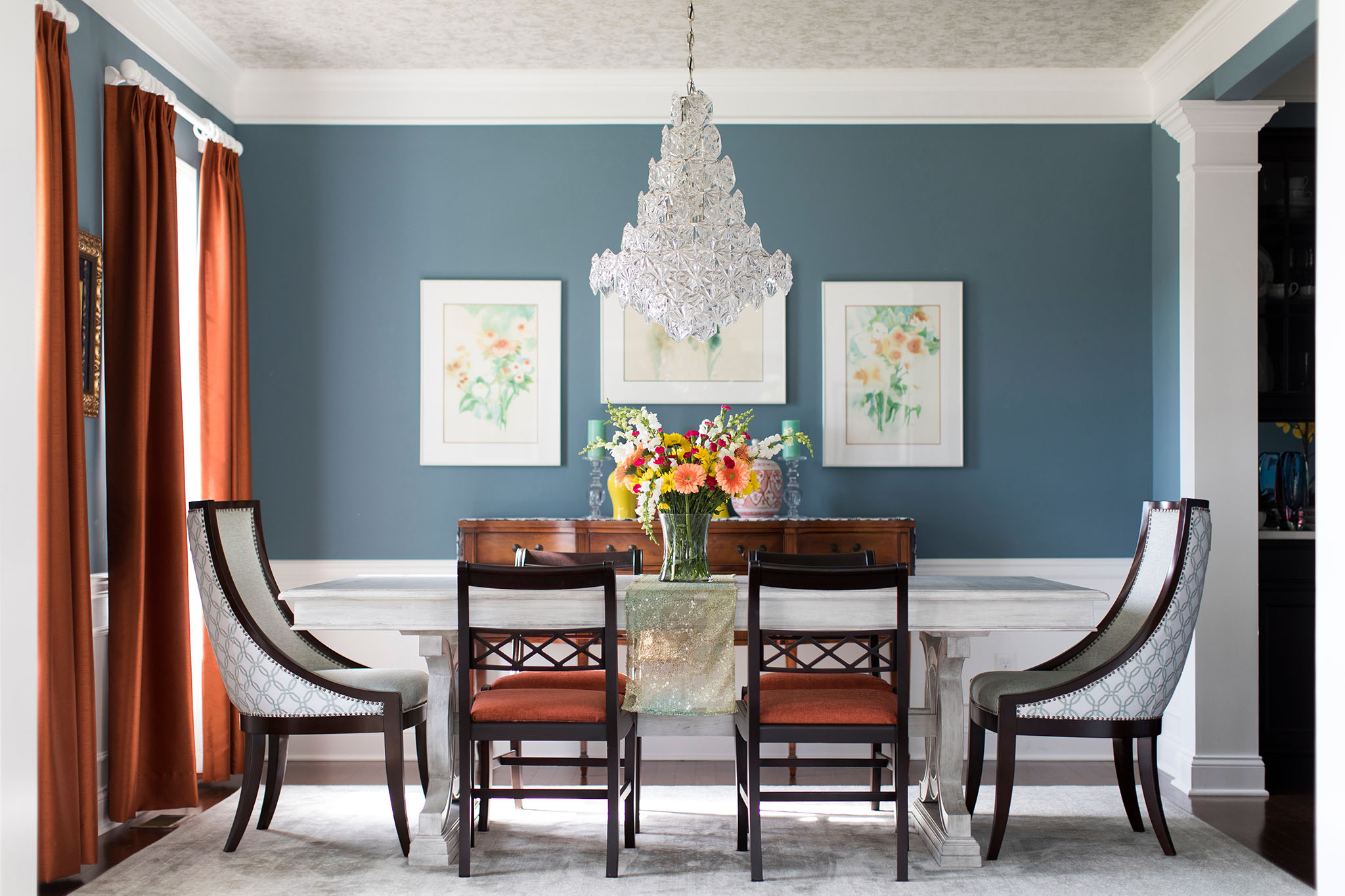 Colorful Contemporary Dining Room with a mix of mix of blues, corals, and yellows Lindsey Putzier Design Studio