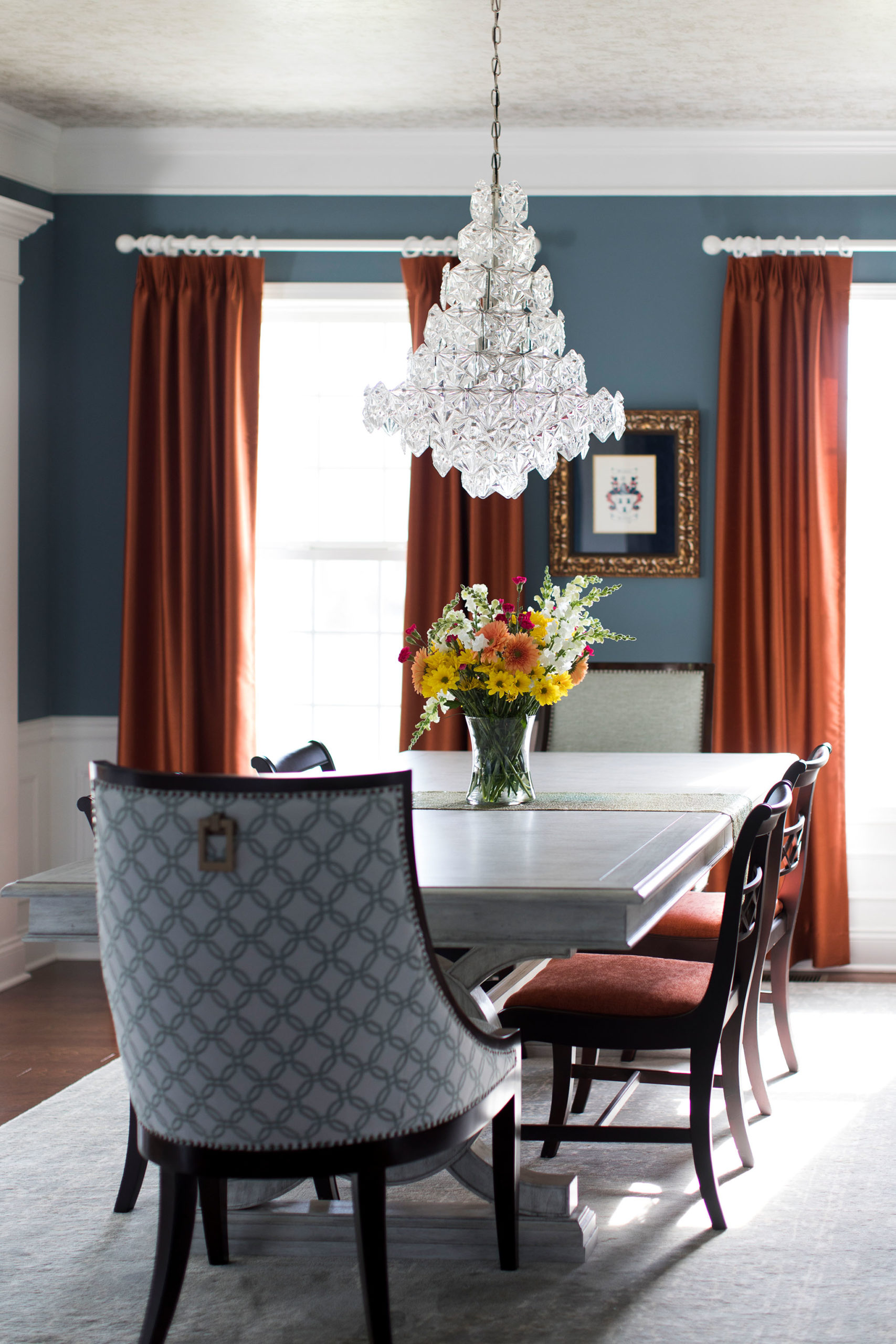 Orange Drapery Panels contrasting Blue Dining Room Walls Lindsey Putzier Design Studio Ohio