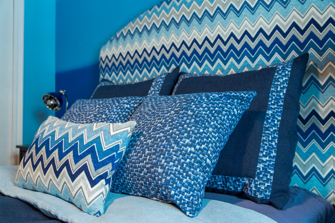 blue-accent-pillows-chevron-headboard-boys-bedroom