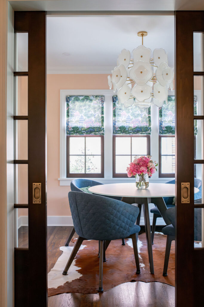 Looking into the sun room from the family room with light and fun design elements. Shaker Heights Ohio interior design Lindsey Putzier