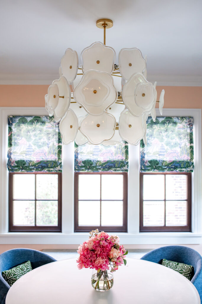Glass floral chandelier in the sun room above the dining table. Shaker Heights Ohio interior design Lindsey Putzier