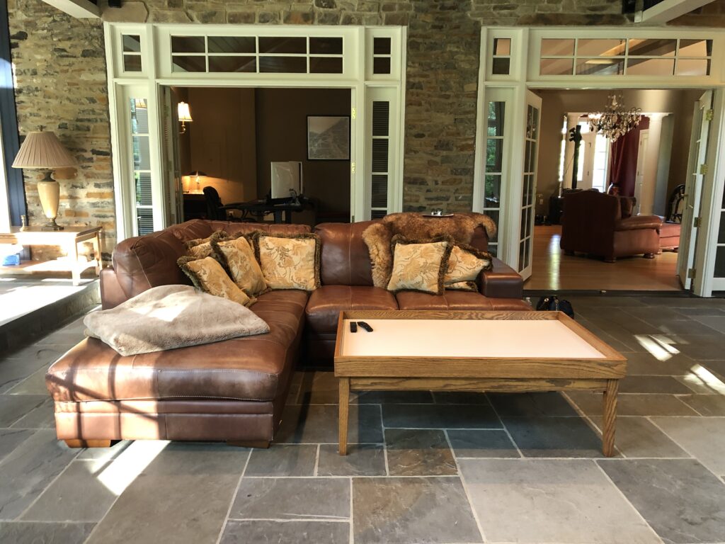 Before image of Sunroom leather sectional. Lindsey Putzier Design Studio