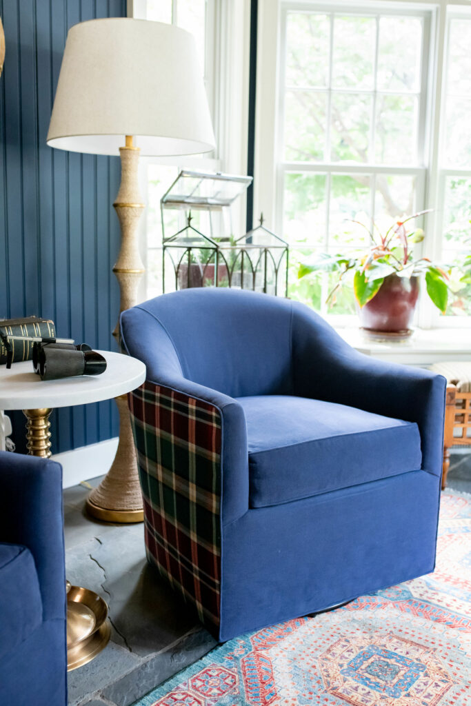 Blue swivel chairs with plaid upholstery on the outside and a deep blue inside Lindsey Putzier