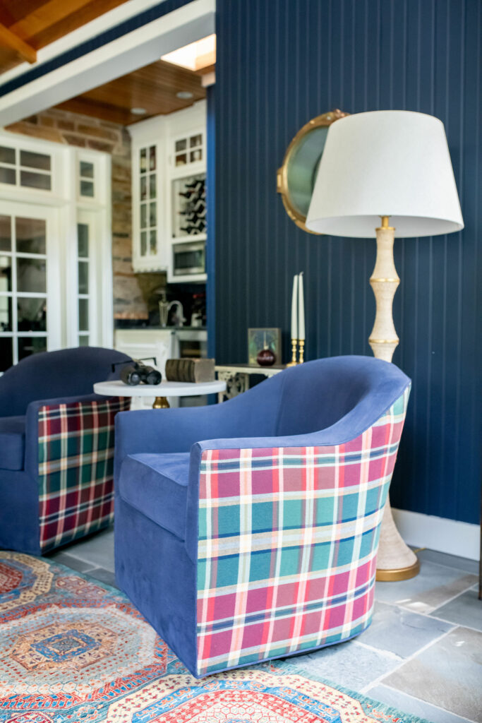 Blue swivel chairs with plaid upholstery on the outside and a deep blue inside Lindsey Putzier