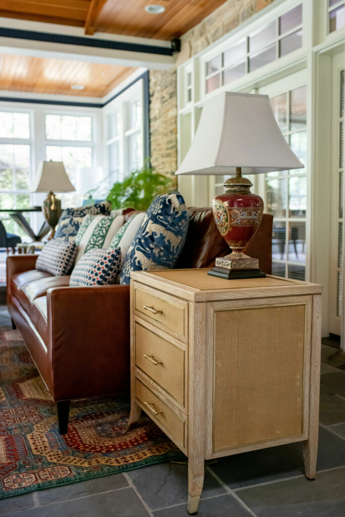 Occasional tables and custom pillows in Sunroom Design Lindsey Putzier Hudson, OH