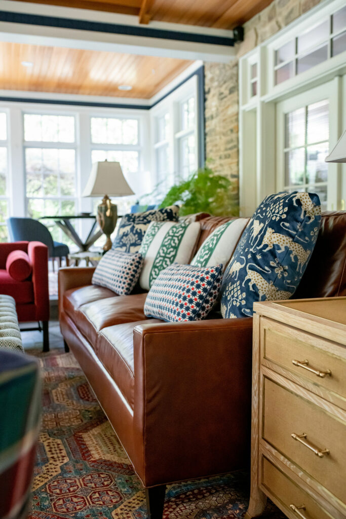 After image of leather sofa in Sunroom Design Lindsey Putzier Design Studio Hudson, OH