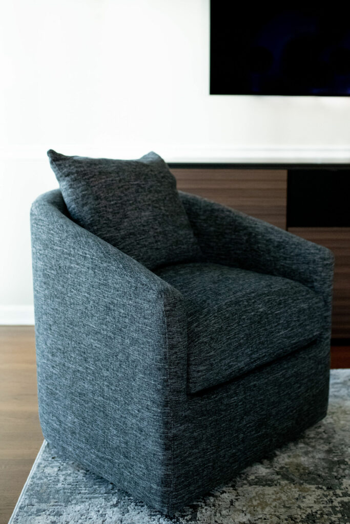 low-profile swivel chair with a textured gray fabric Lindsey Putzier Design Studio Ohio