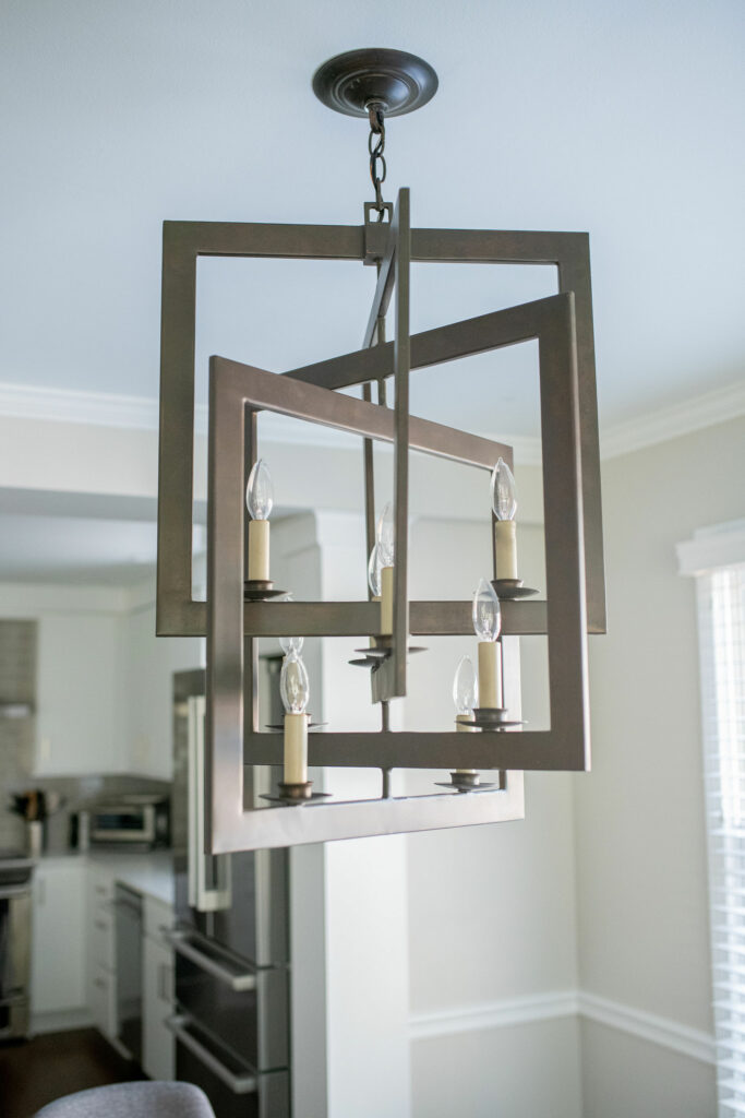 Dinette chandelier made of interlocking squares in bronze gold Lindsey Putzier Design Studio Hudson, OH