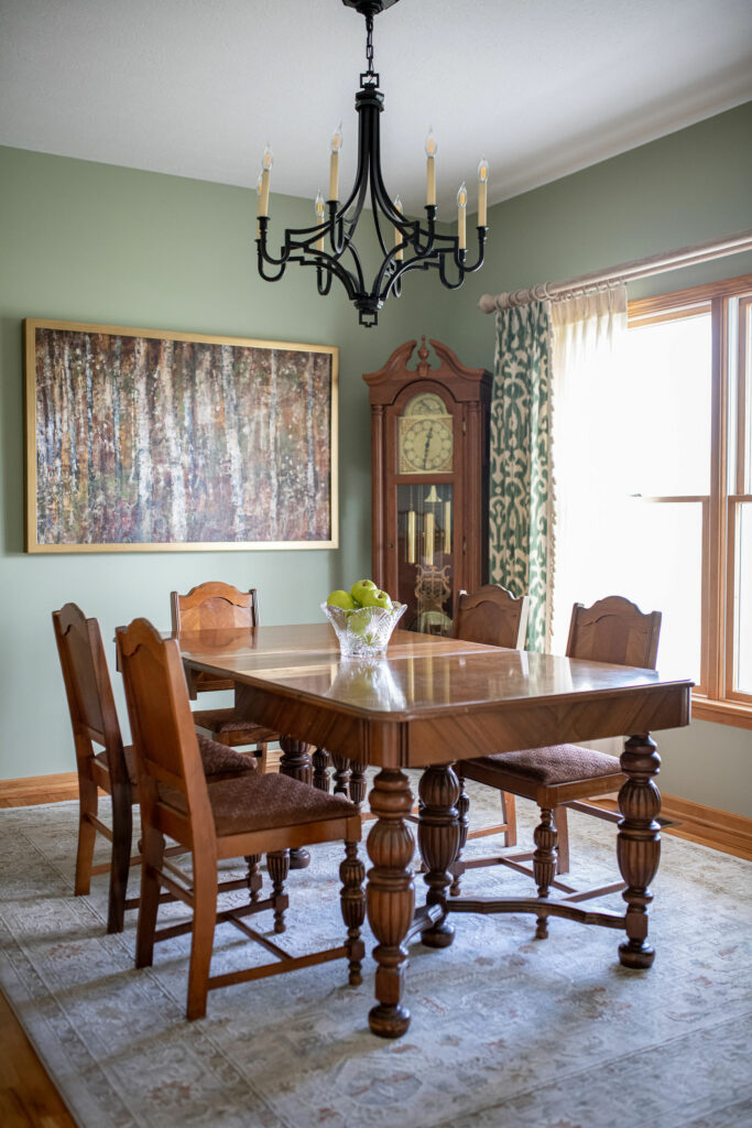 Dining room update with new rug, custom window treatments, light green paint, artwork, and chandelier. Lindsey Putzier Hudson, OH