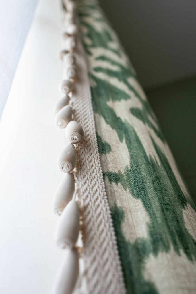 Custom drapery window treatment for Dining Room. Green patterned fabric with bead tassel trim. Lindsey Putzier Design Studio Hudson, OH