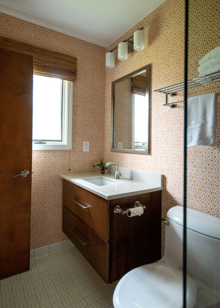 Updated sink in bathroom design from a shell shape to a contemporary rectangle. Lindsey Putzier Design Studio Hudson, OH