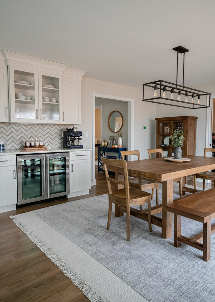 After image of Dining Room design with wall taken out between Kitchen Lindsey Putzier Design Studio. Hudson, OH