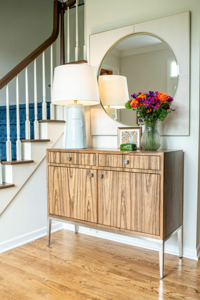 Foyer design with new cabinet, table lamp, and mirror. Lindsey Putzier Design Studio Hudson, OH