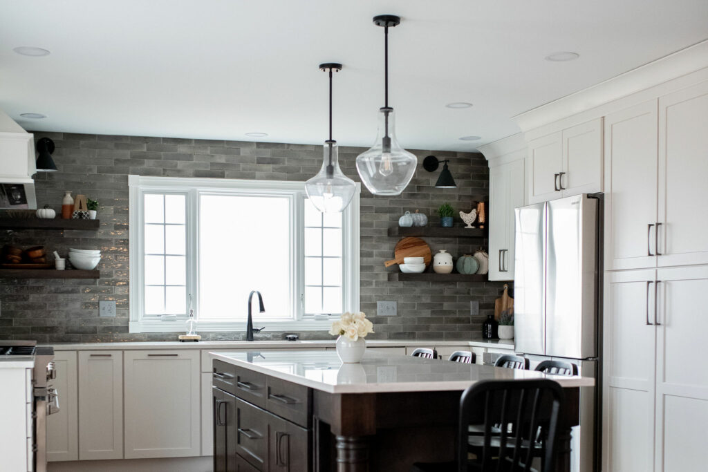 Deep full-height pantry cabinets with pullout drawers up to around 54” high in Kitchen Design Lindsey Putzier Design Studio Hudson, OH