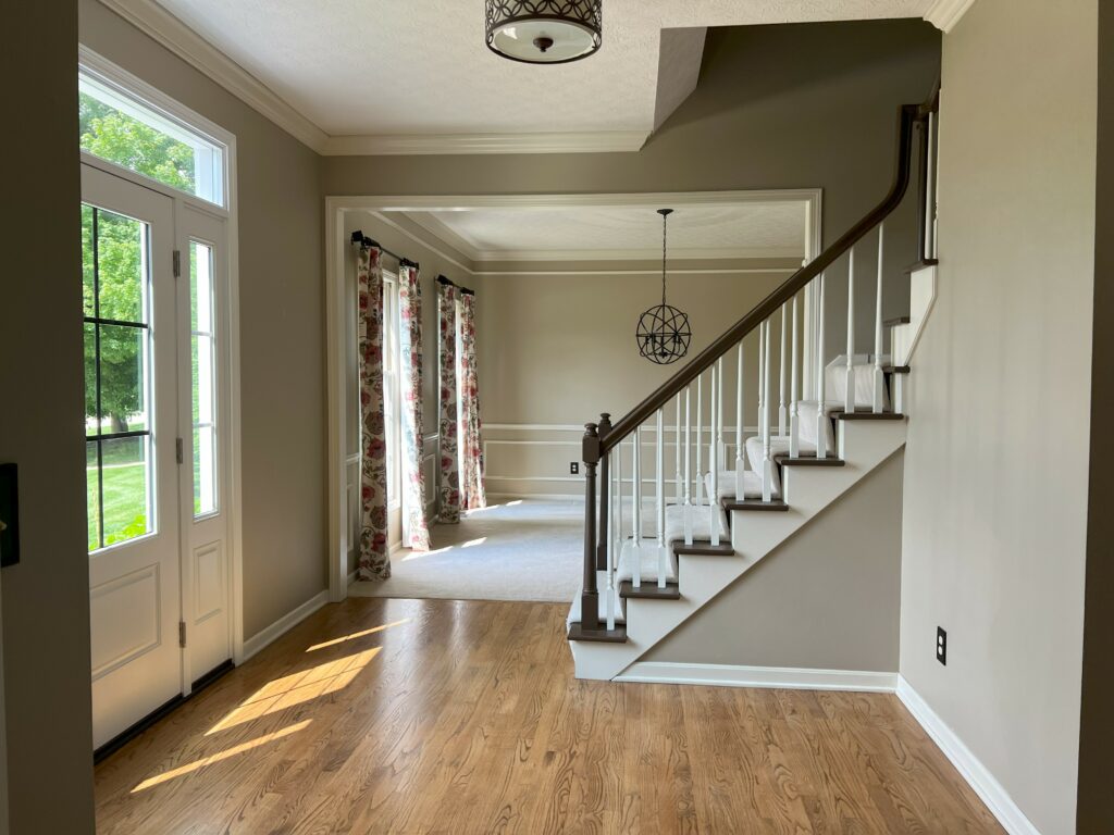 Before image of Foyer Stairs. Lindsey Putzier Design Studio. Hudson, OH