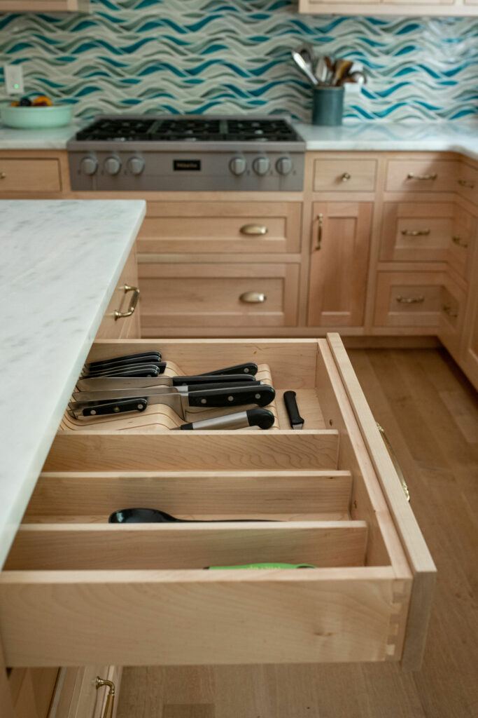 Custom storage inserts within cabinetry. Solon, OH Lindsey Putzier Design Studio