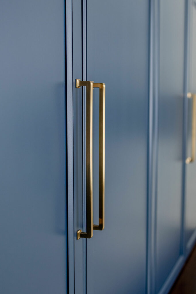 Blue cabinetry storage in Mudroom design. Lindsey Putzier Design Studio. Hudson, OH