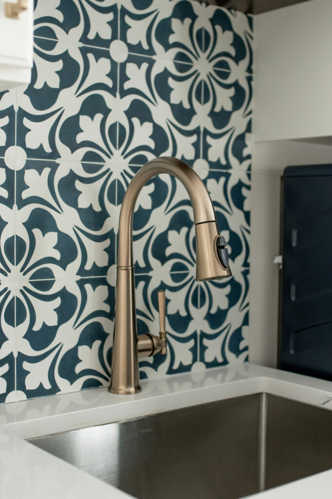 Geometric backsplash with Mudroom sink and faucet. Lindsey Putzier Design Studio. Hudson, OH