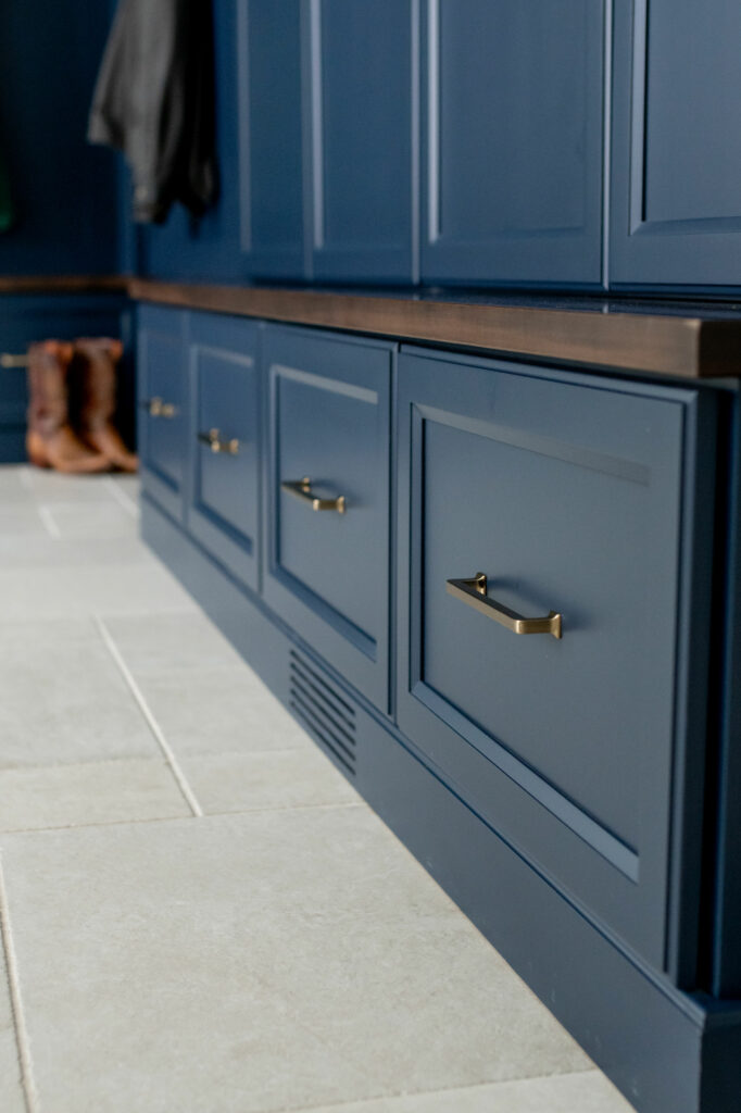 Blue cabinetry storage in Mudroom design. Lindsey Putzier Design Studio. Hudson, OH