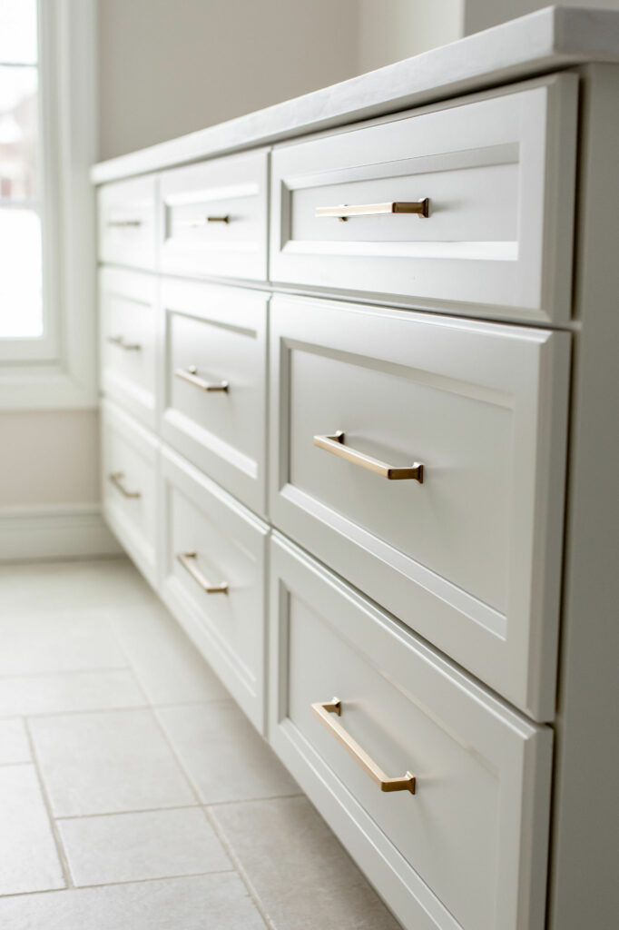 White cabinetry drawer storage in Mudroom design. Lindsey Putzier Design Studio. Hudson, OH