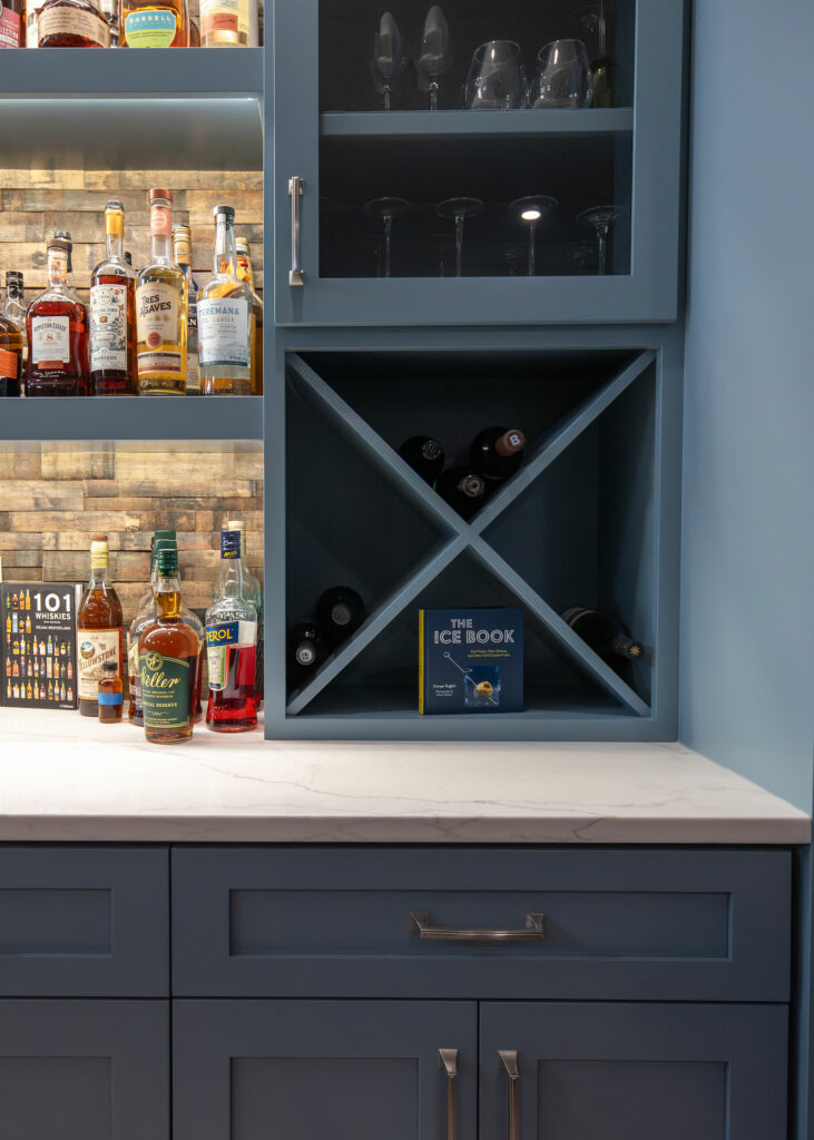 Additional storage types within cabinetry of Whiskey Bar design. Lindsey Putzier Design Studio Hudson, OH