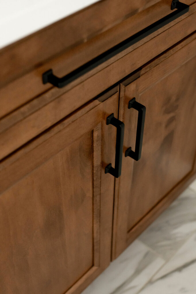Close up of maple cabinets in Primary Bathroom. Lindsey Putzier Design Studio Hudson, OH