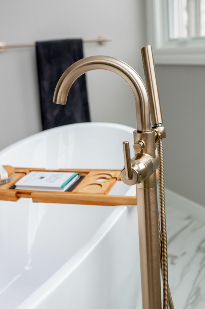 Bathtub faucet for freestanding tub in Primary Bathroom design. Lindsey Putzier Design Studio Hudson, OH