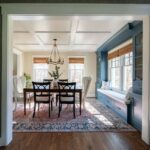 Newly renovated dining room with a beautiful bay window and modern chandelier. Lindsey Putzier Design Studio, Hudson, Ohio