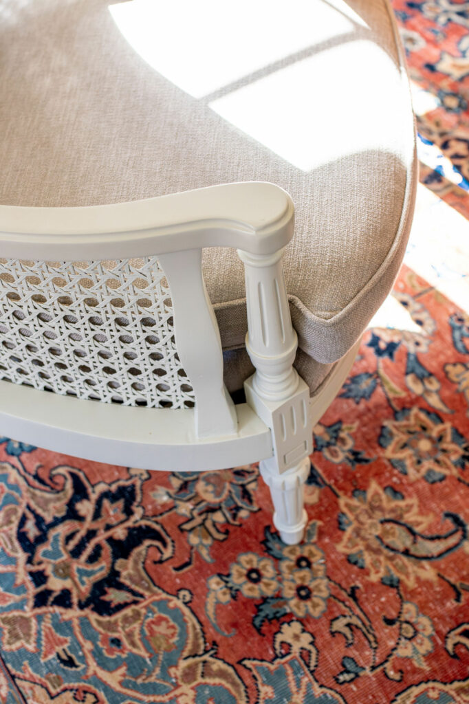 Close up view of the vintage chair that was re-upholstered with performance fabrics. Lindsey Putzier Design Studio, Hudson, Ohio