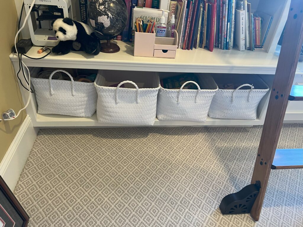 White woven storage baskets in shelves of Office design. Lindsey Putzier Design Studio. Hudson, OH