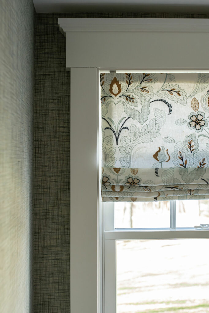 Close up of the textured wall paper with custom roman shades. Lindsey Putzier Design Studio, Hudson, Ohio