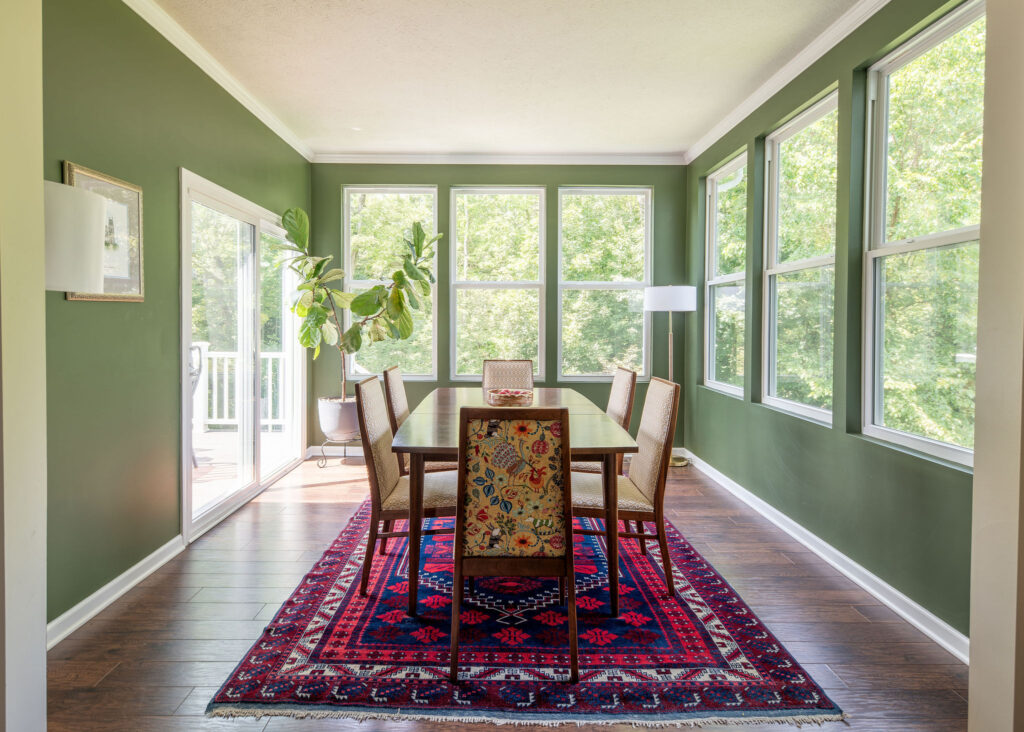 After of the dining room with patterned rug, custom vintage reupholstered chairs, and fresh green paint. Hudson Ohio interior design, Lindsey Putzier 
