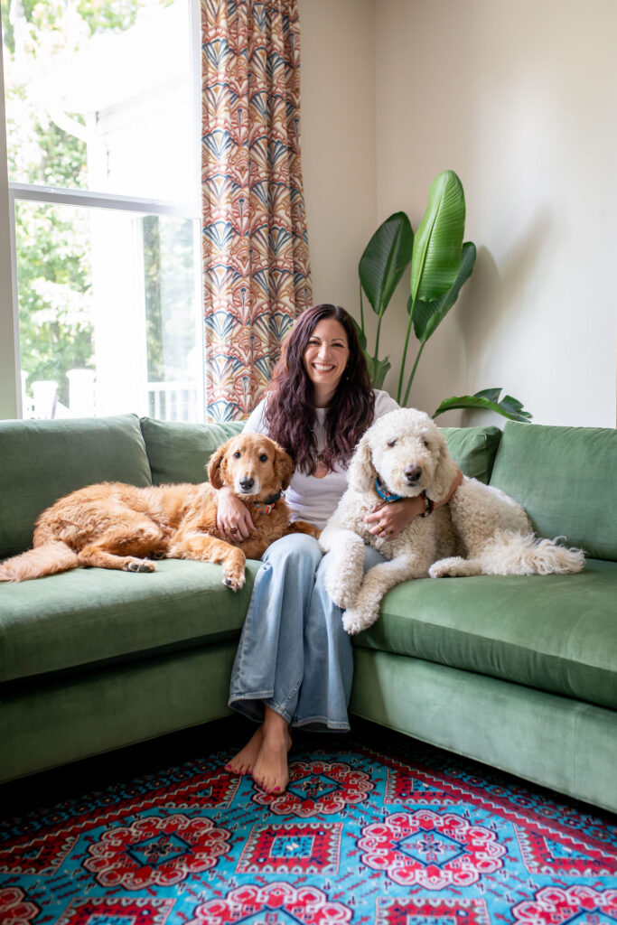 Lindsey Putzier, owner and principle designer, sitting in Hudson Ohio newly styled living room. 