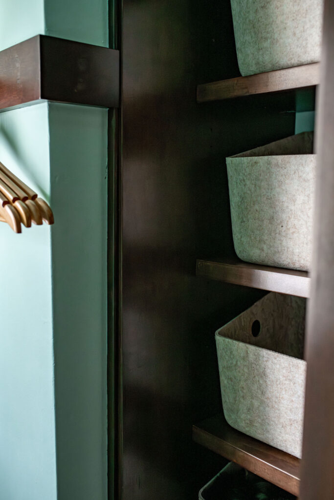 Organization in the coat closet just off the vestibule with bins for storage. Shaker Heights Ohio Lindsey Putzier