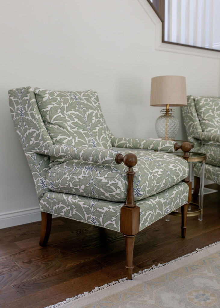 Upholstered green patterned chairs in the living room. Chagrin Falls Ohio interior design Lindsey Putzier 