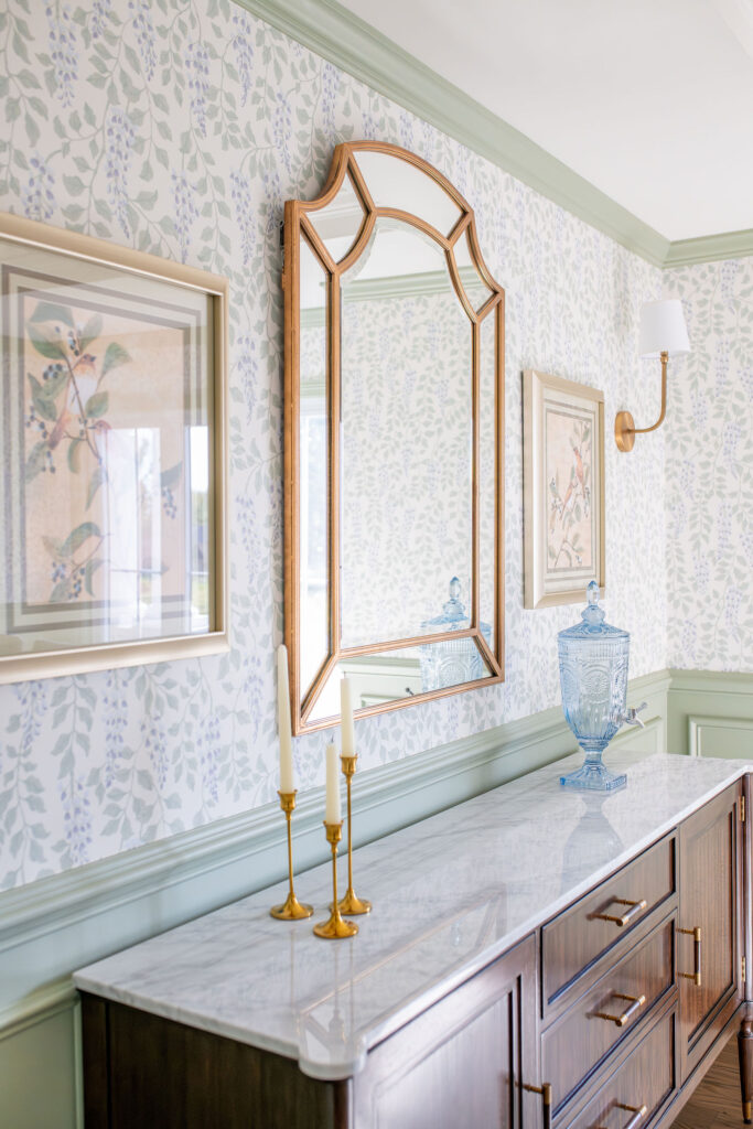 Dining room in Chagrin Falls with light green floral wallpaper and deep wood. Chagrin Falls Ohio interior design Lindsey Putzier