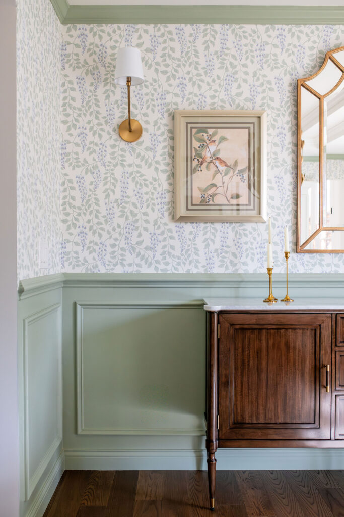 Dining room in Chagrin Falls with light green floral wallpaper and deep wood. Chagrin Falls Ohio interior design Lindsey Putzier