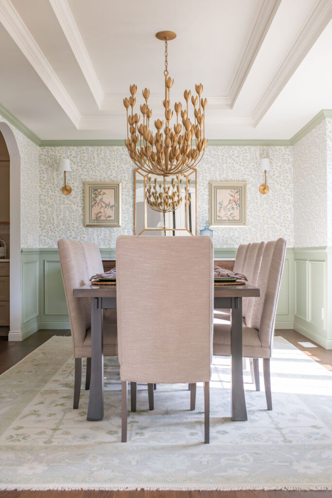 Dining room in Chagrin Falls with light green floral wallpaper and deep wood. Chagrin Falls Ohio interior design Lindsey Putzier