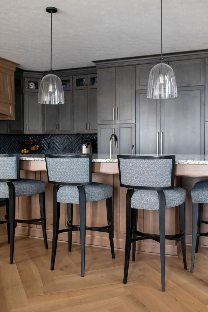 Kitchen island with 4 custom barstools and pendant lighting. Brecksville Ohio interior design Lindsey Putzier