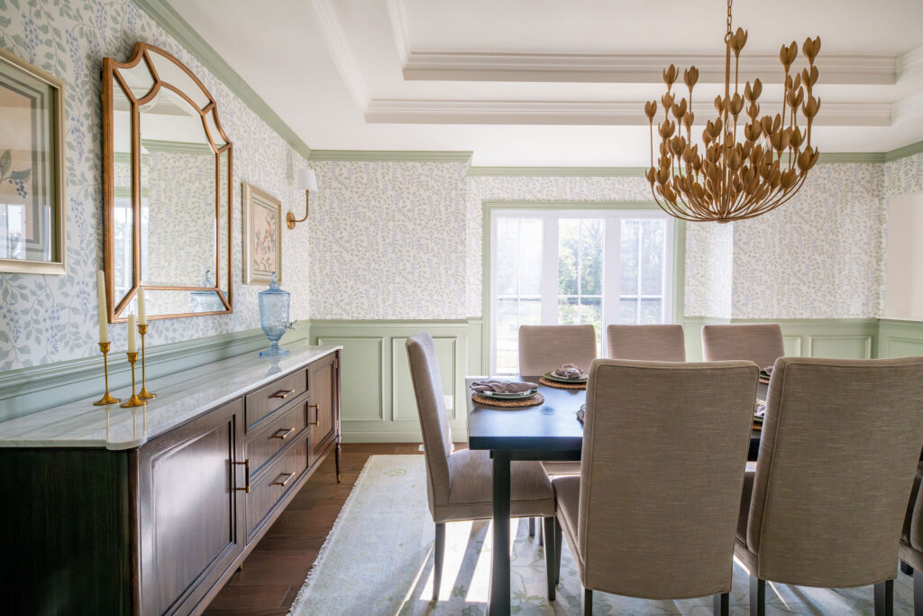 Dining room with floral wallpaper and soft wooden features. Chagrin Falls Ohio interior design Lindsey Putzier interior design