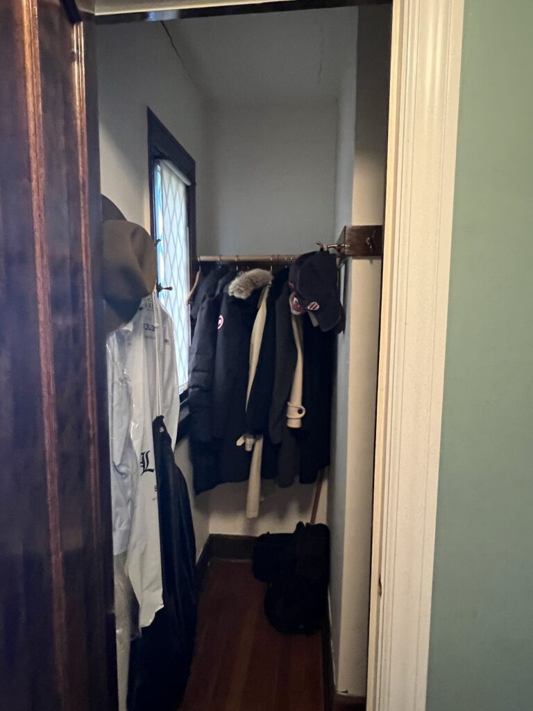 Before of the coat closet just off the vestibule Shaker Heights Ohio interior design Lindsey Putzier