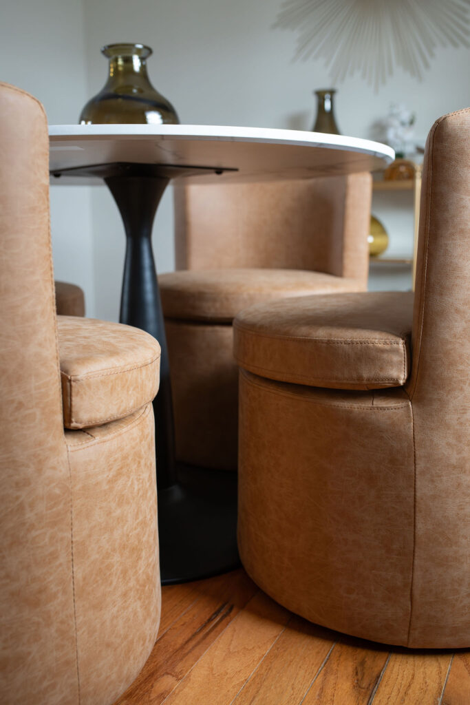 Table in the dining room with a marble countertop. Lindsey Putzier interior design Parma Ohio