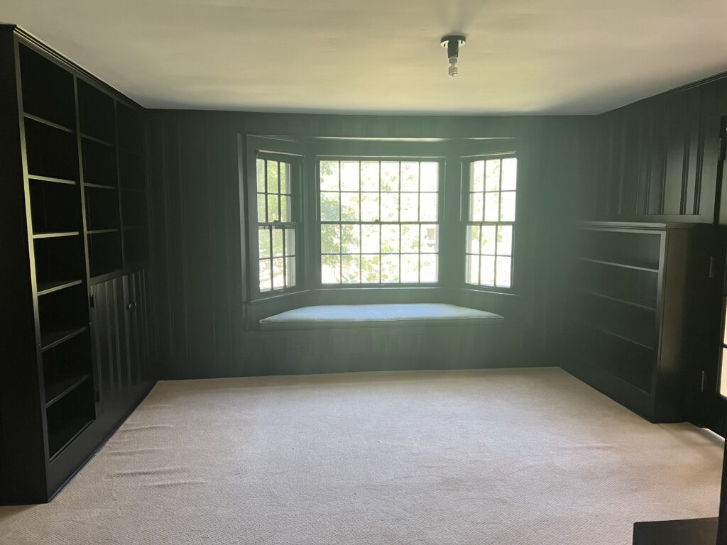 Before of the window seat in Hudson Ohio study with cream carpet. Lindsey Putzier interior design