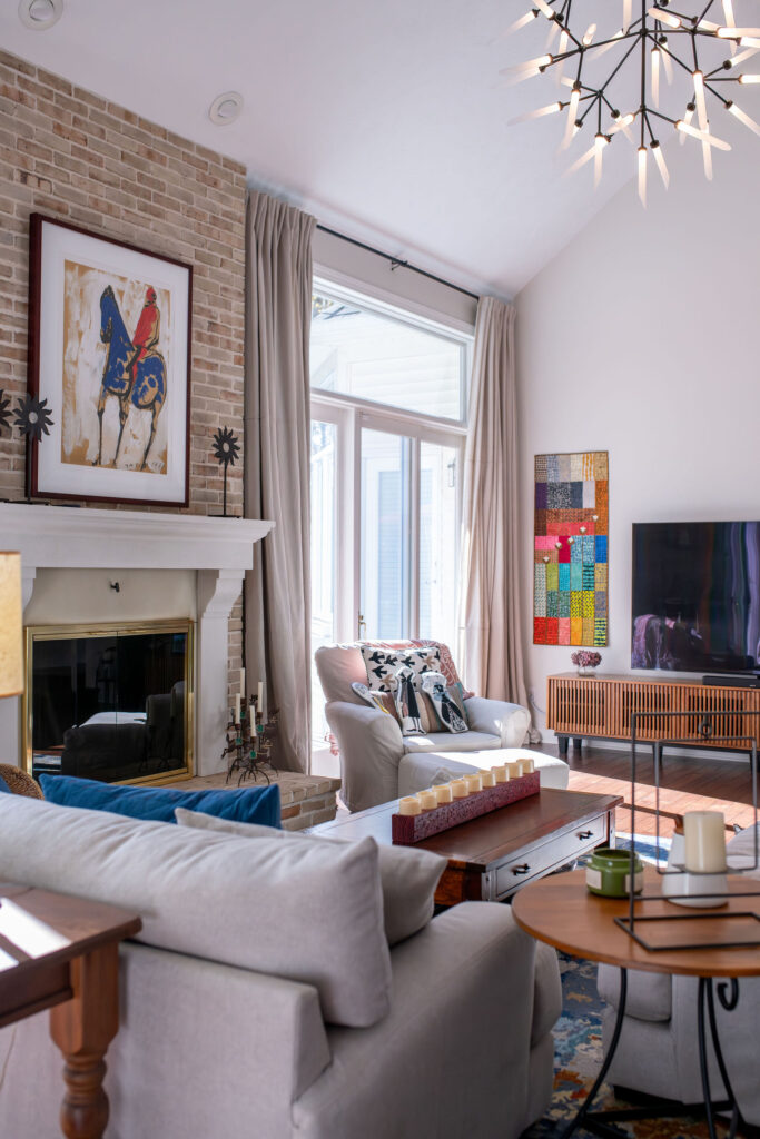 Living room redesign with accents of colorful Art. Lindsey Putzier interior design Chagrin Falls Ohio