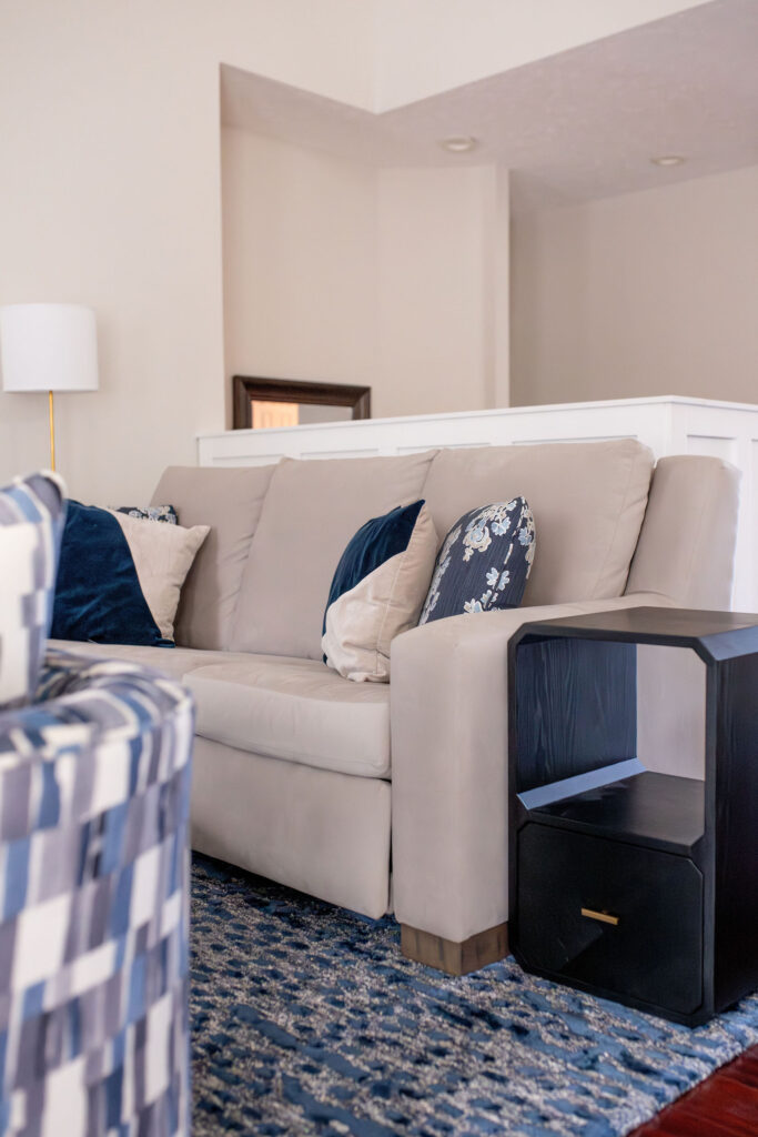 Dining room in Peninsula Ohio with dark wood finished and indigo blue patterns. Lindsey Putzier interior design 