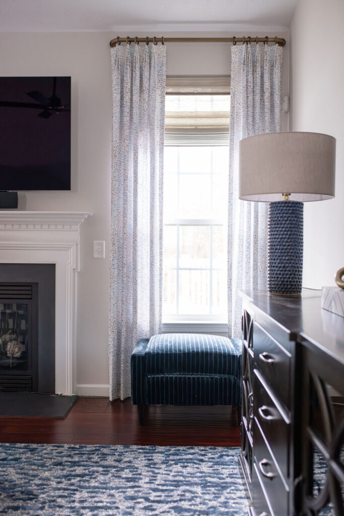 Dining room in Peninsula Ohio with dark wood finished and indigo blue patterns. Lindsey Putzier interior design 