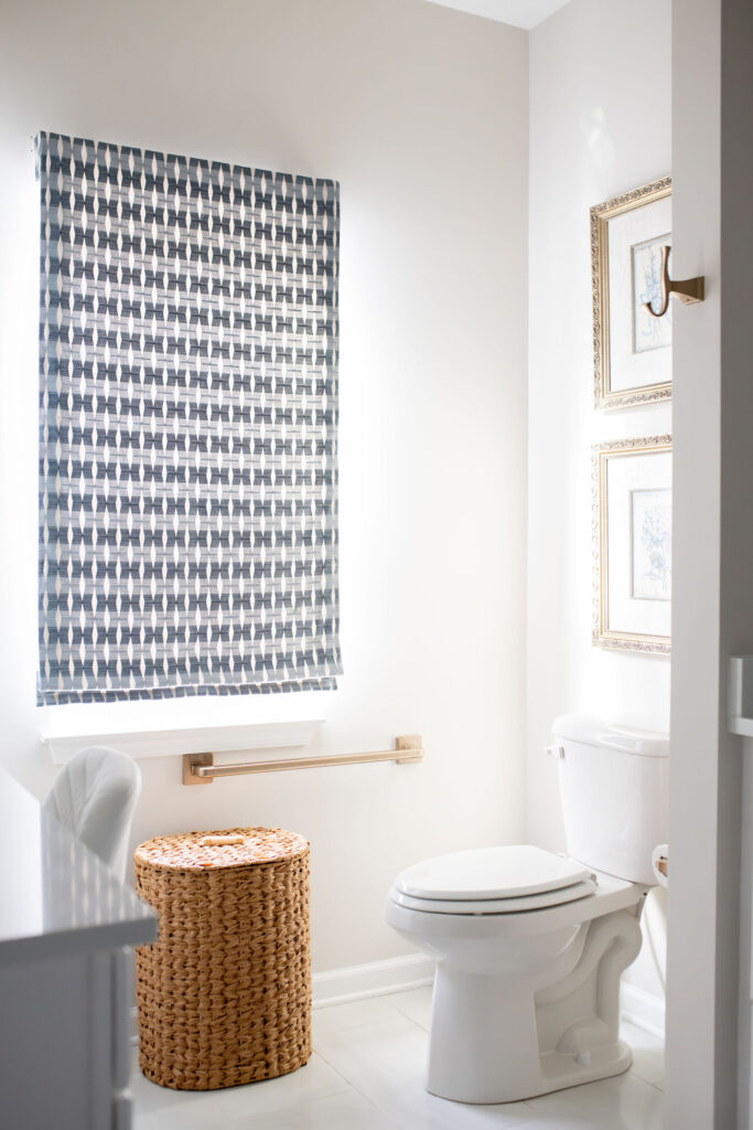 Master bathroom in Peninsula Ohio with large blue patterned custom window treatment. Lindsey Putzier interior design
