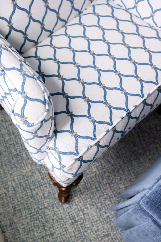 Custom upholstered indigo patterned chairs in the master bedroom. Peninsula Ohio Lindsey Putzier interior design