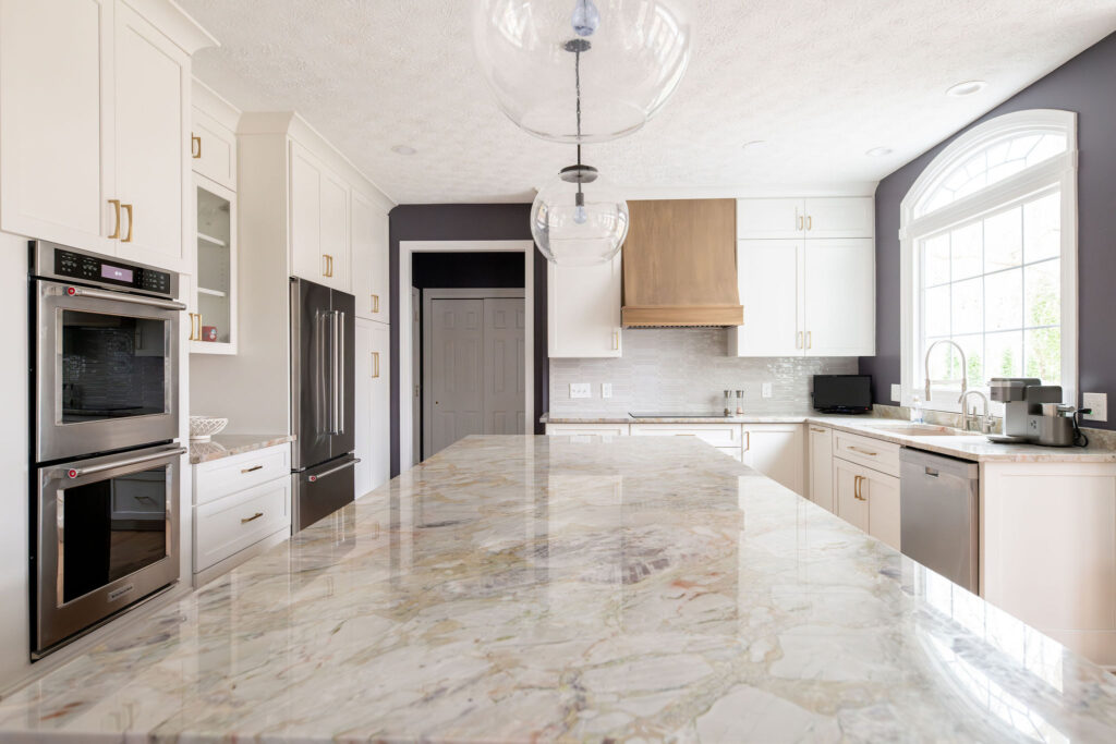 Large granite countertop in the kitchen of Aurora Ohio home. Lindsey Putzier interior design