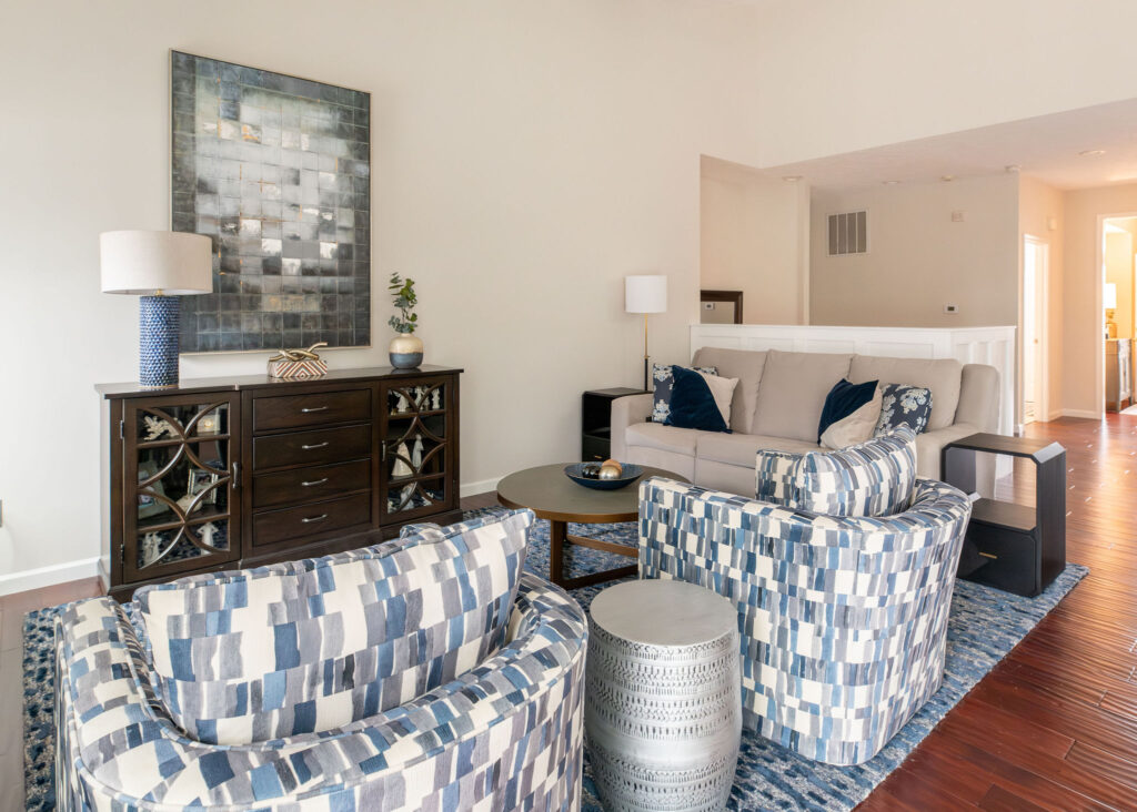 Dining room in Peninsula Ohio with dark wood finished and indigo blue patterns. Lindsey Putzier interior design 